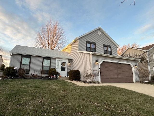 view of front of property with a garage and a front yard