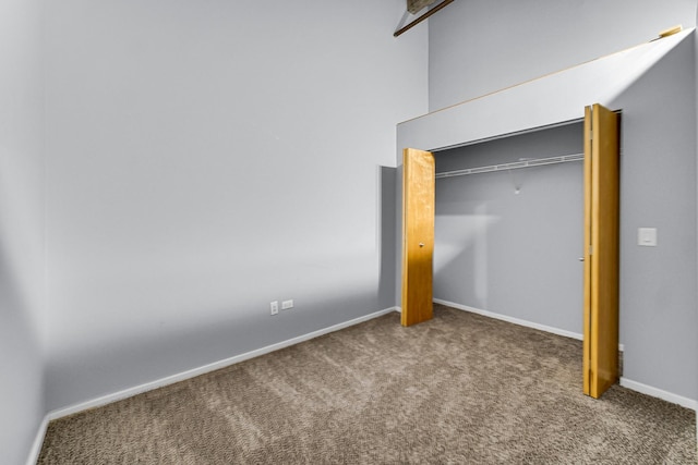 unfurnished bedroom with carpet flooring