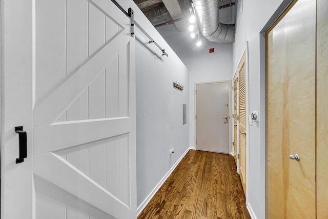 corridor featuring wood-type flooring