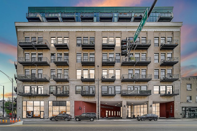 view of outdoor building at dusk