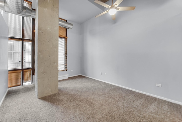 unfurnished room with ceiling fan and light carpet