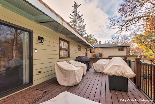 wooden terrace featuring grilling area