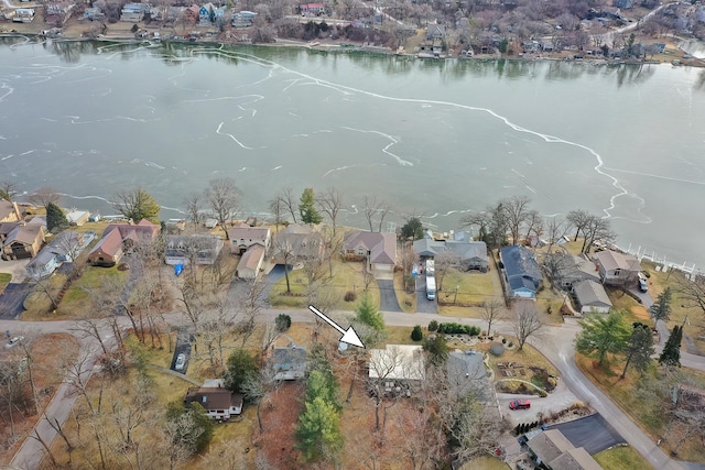 birds eye view of property with a water view