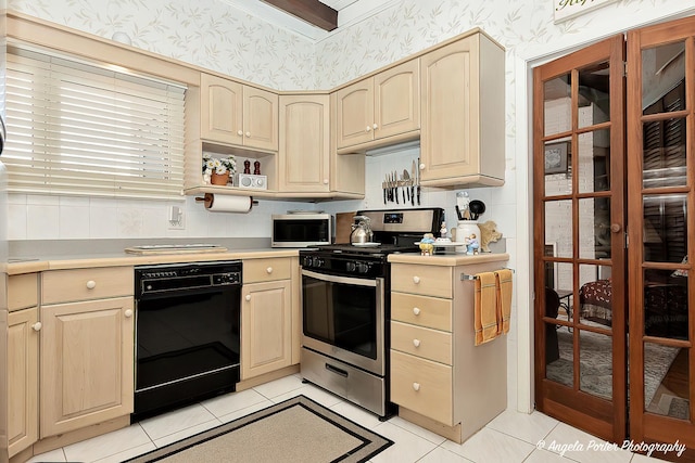 kitchen featuring stainless steel range, light tile patterned floors, and light brown cabinets