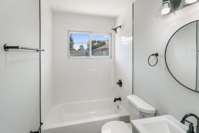 full bathroom featuring bathing tub / shower combination, toilet, and sink