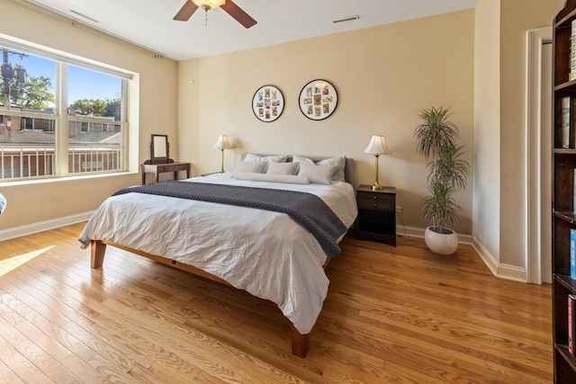 bedroom featuring ceiling fan and light hardwood / wood-style flooring