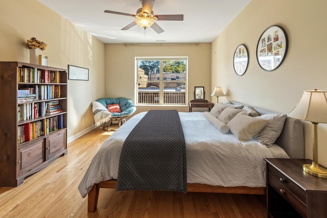 bedroom featuring light hardwood / wood-style floors and ceiling fan