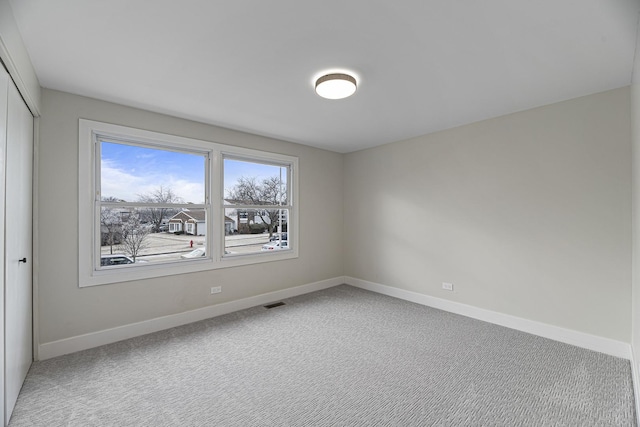 spare room featuring carpet flooring