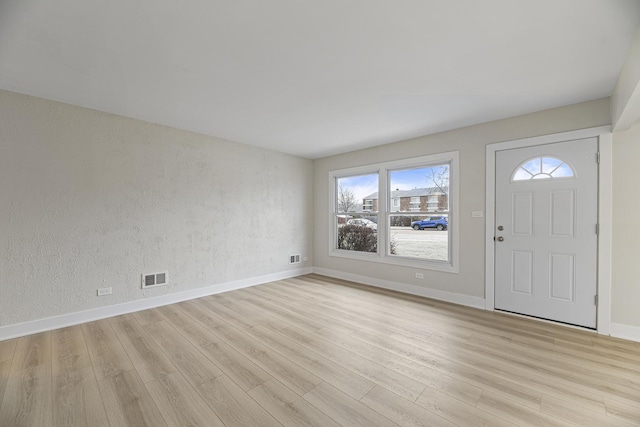 entrance foyer with light hardwood / wood-style floors