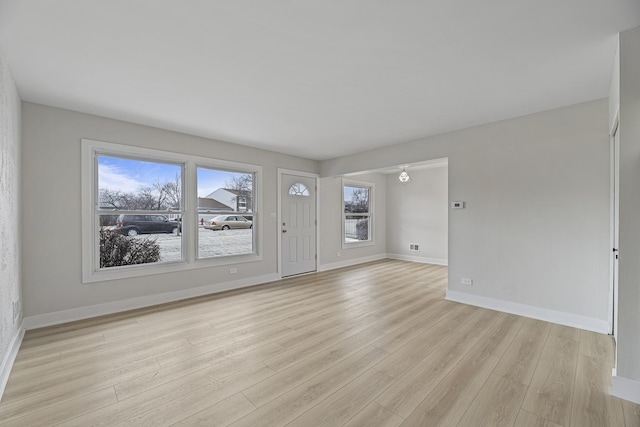 interior space featuring light hardwood / wood-style flooring and a wealth of natural light