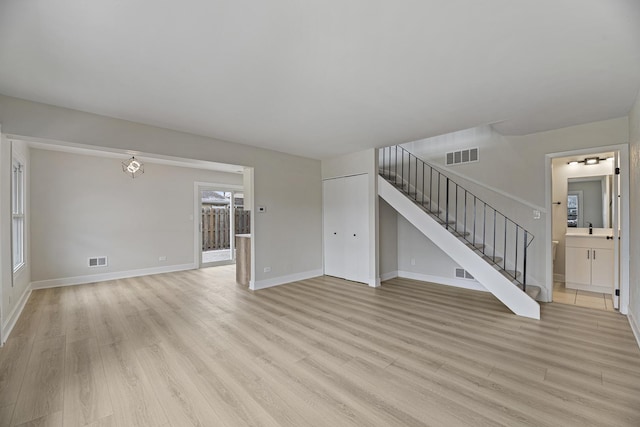 unfurnished living room featuring light hardwood / wood-style floors