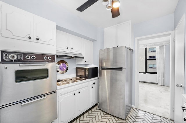 kitchen with stainless steel appliances, white cabinetry, and ceiling fan