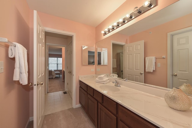 bathroom with vanity and tile patterned floors