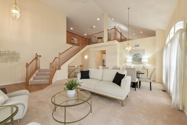 living room featuring a notable chandelier and high vaulted ceiling