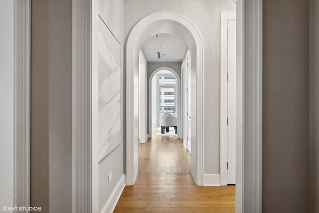 hall with light hardwood / wood-style floors