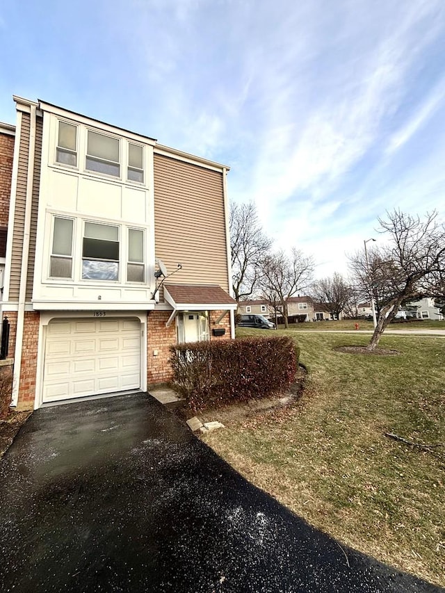 view of property exterior featuring a yard and a garage