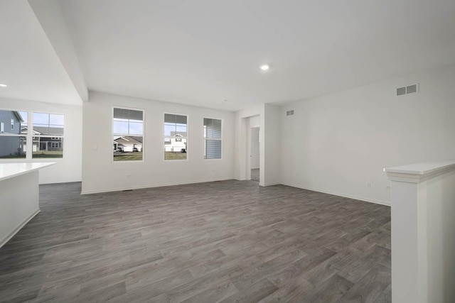 unfurnished living room featuring dark hardwood / wood-style floors