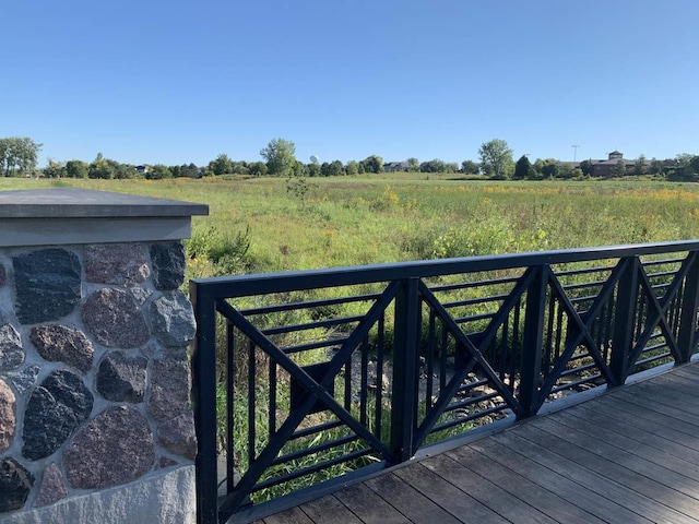 wooden terrace with a rural view