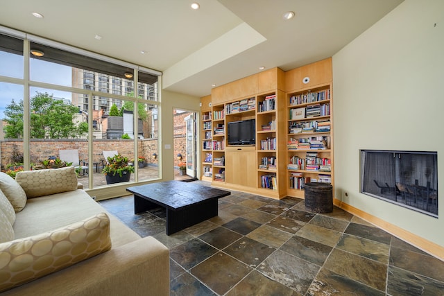 living room featuring floor to ceiling windows