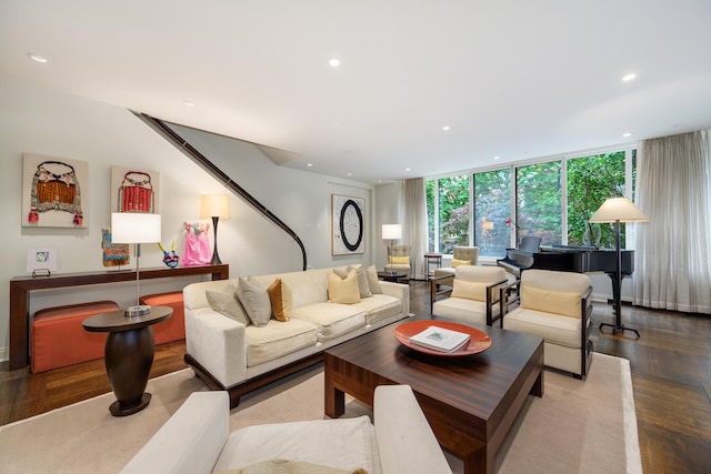 living room with light wood-type flooring and a wall of windows