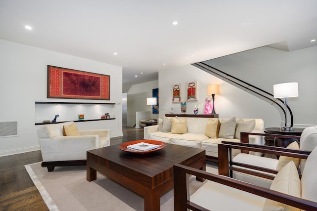 living room featuring dark parquet flooring