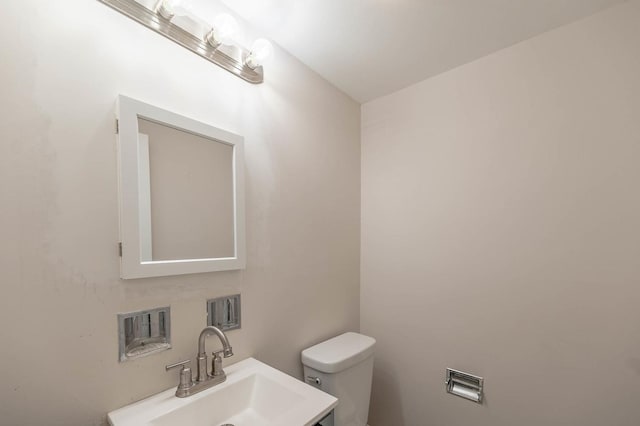 bathroom featuring toilet and sink