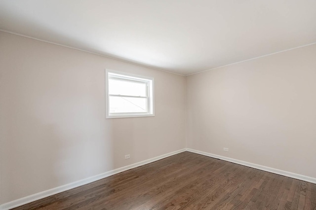 unfurnished room with dark hardwood / wood-style flooring