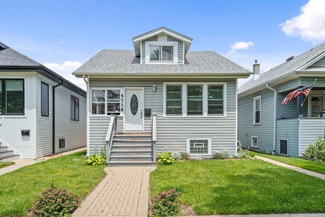 view of front of property featuring a front yard