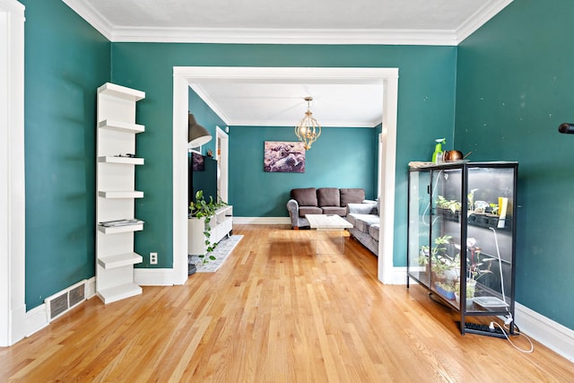 interior space featuring hardwood / wood-style flooring and crown molding