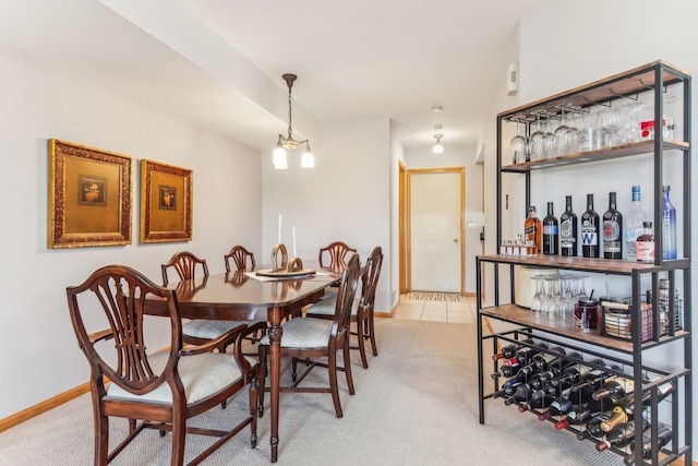 carpeted dining space featuring indoor bar