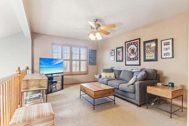 living room with ceiling fan and light colored carpet