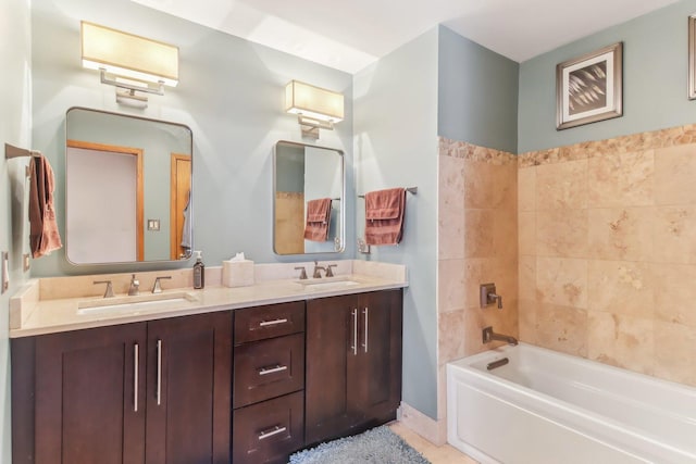 bathroom with shower / tub combination, tile patterned floors, and vanity