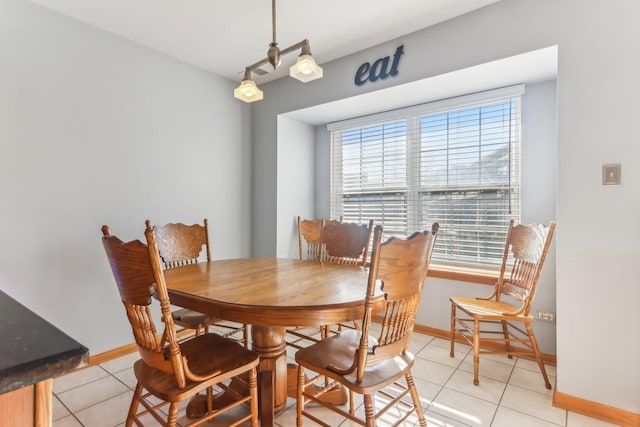 dining area featuring light tile patterned floors