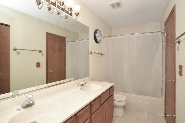 full bathroom with vanity, toilet, and shower / bath combo with shower curtain