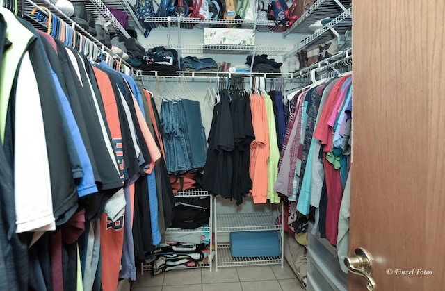 spacious closet with light tile patterned flooring