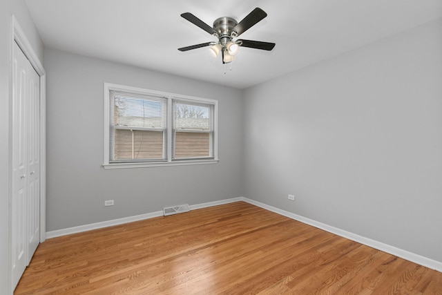 unfurnished bedroom with a closet, ceiling fan, and light hardwood / wood-style floors