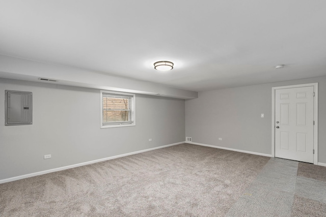 basement with electric panel and carpet