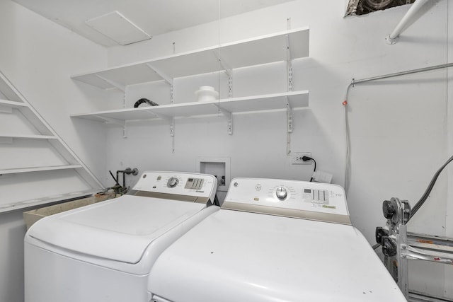 laundry area with washing machine and clothes dryer