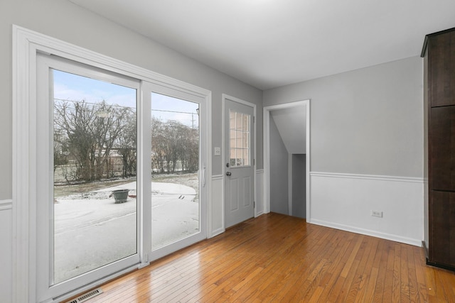 entryway with hardwood / wood-style flooring