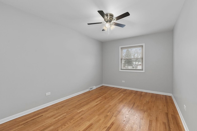 spare room with ceiling fan and light hardwood / wood-style floors