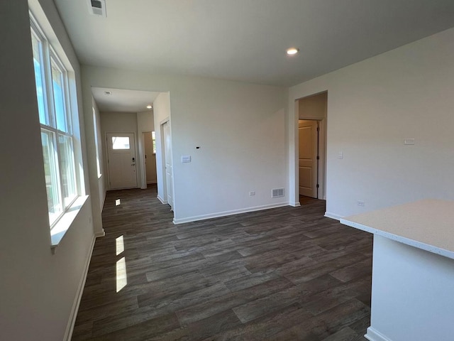 unfurnished room featuring dark hardwood / wood-style flooring