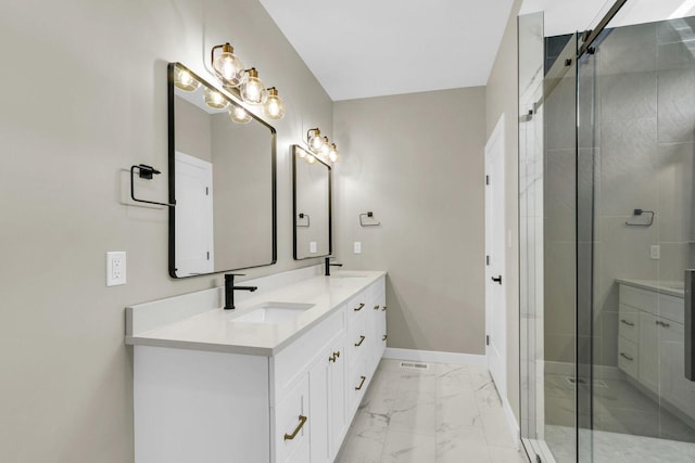 bathroom with vanity and a shower with shower door