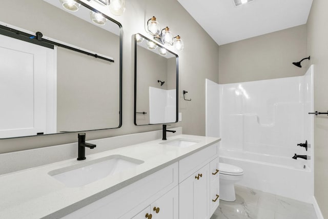 full bathroom with vanity, washtub / shower combination, and toilet