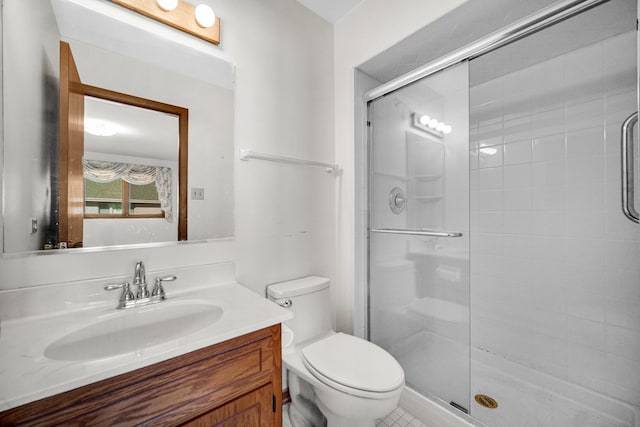 bathroom with walk in shower, vanity, and toilet