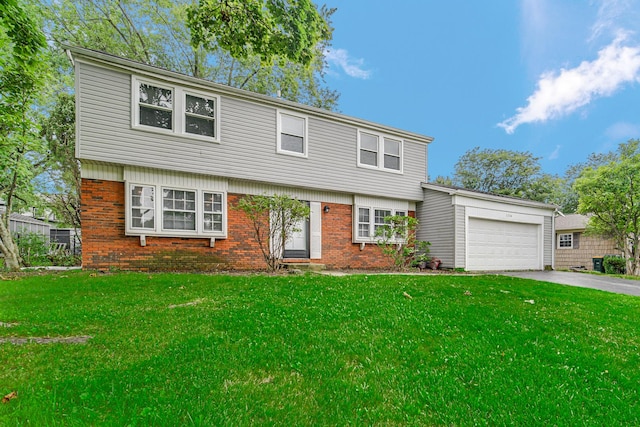 front of property with a front yard and a garage