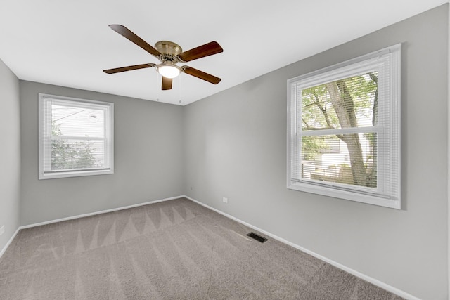 carpeted empty room with ceiling fan