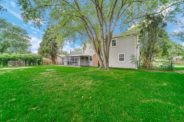 view of yard with a sunroom