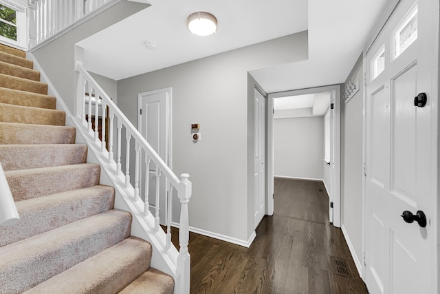 foyer entrance featuring dark hardwood / wood-style flooring