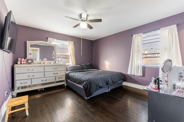 bedroom featuring ceiling fan and dark wood-type flooring