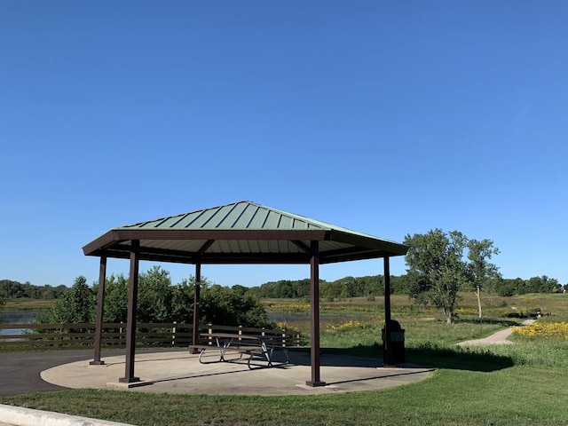 view of property's community with a gazebo and a yard